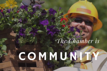 The Chamber is Community: HCC worker hangs a flower basket